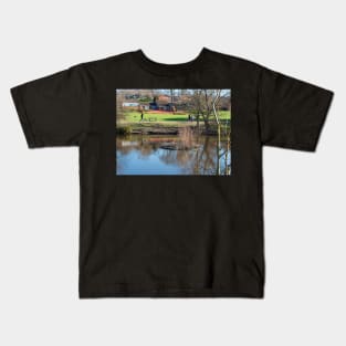 Dog walking in the park Kids T-Shirt